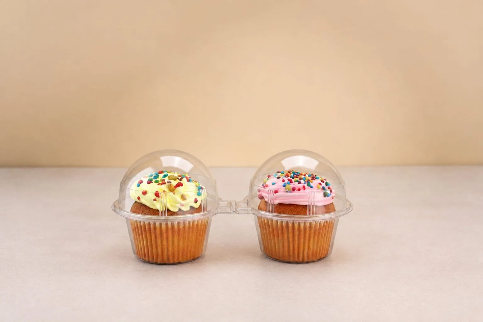 PET Cupcake Hinged Box with Dome Lid, code 1414, holding two cupcakes