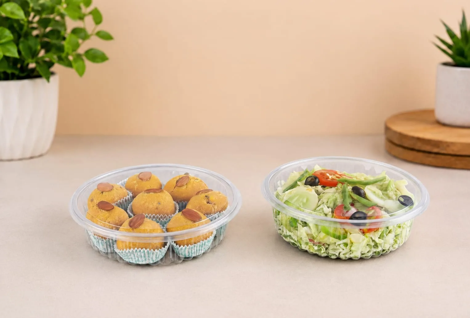 PET Round Hinged Box with Flat Lid, codes 1454 and 1455, holding laddoos and a salad