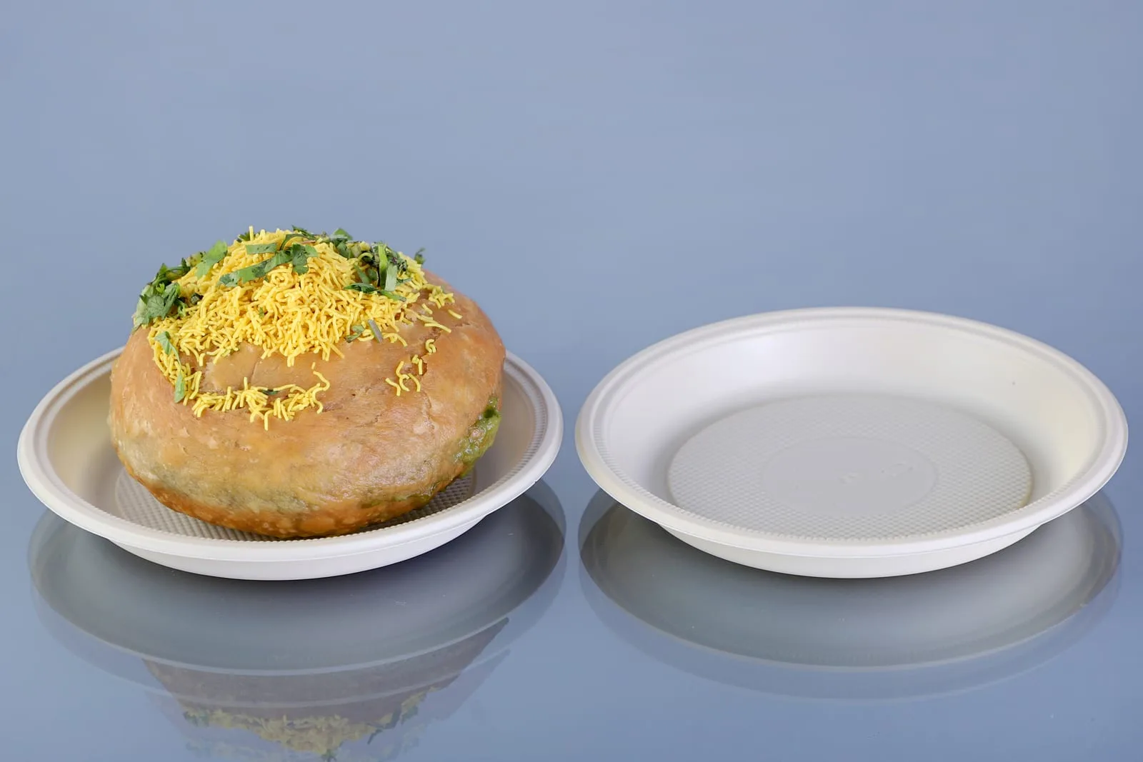 Eco Tray No. 6 Round Plate, code 7016, one holding a kachori, one empty