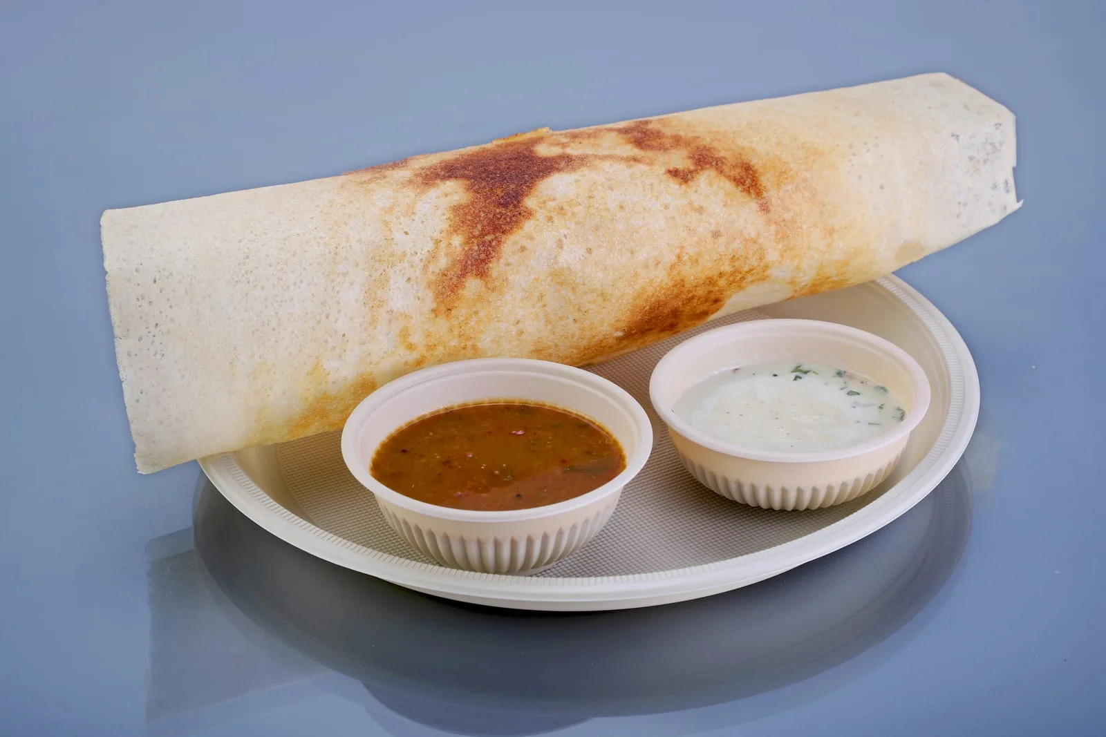 Eco Tray No. 12 Round Plate, code 7026, holding a masala dosa with sambar and chutney