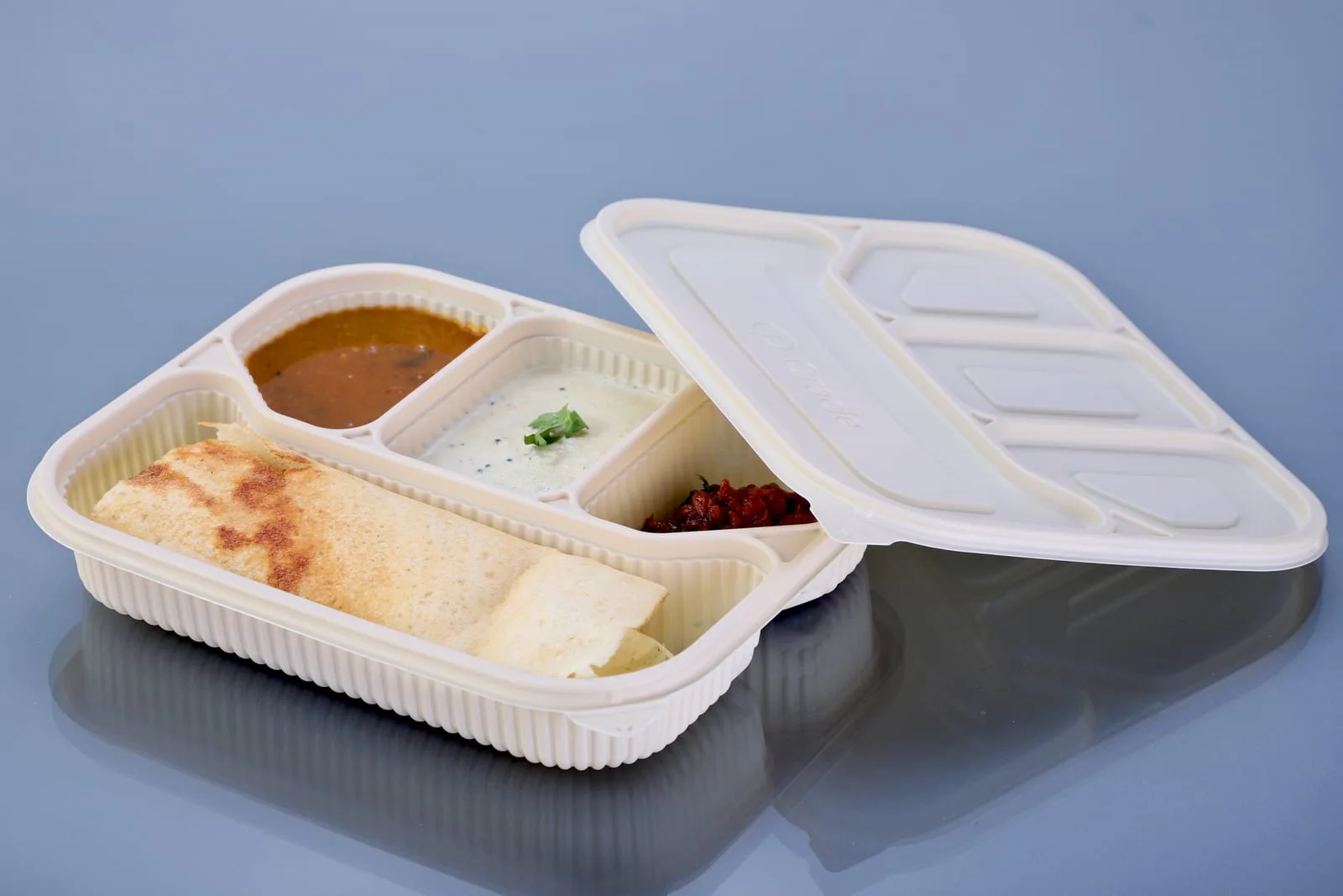 Eco Tray 4 Compartment Cornstarch Meal Box with Lid, codes 7043 and 7043L, holding a dosa, sambar and chutneys