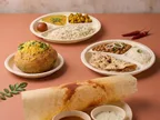 Oracle Group Eco Tray cornstarch plates with dosa, rice and curries