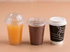Oracle Group cups fitted with dome and flat lids, holding juice, a cold drink and coffee