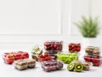 Clear Oracle PET punnets filled with strawberries, cherries, grapes, kiwi and other fruit